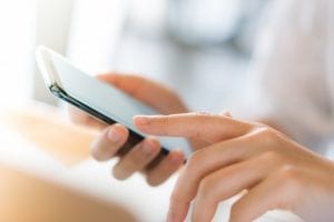 hand with mobile phone